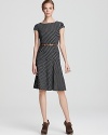 A swing skirt lends a ladylike look to this belted Anne Klein dress, printed in diagonal stripes.