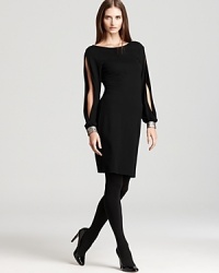 Alluring split sleeves lend provocative spirit to a sleek Karen Kane dress, finished with shimmering contrast cuffs for a captivating cocktail look. Alluring split sleeves lend provocative spirit to a sleek Karen Kane dress, finished with shimmering contrast cuffs for a captivating cocktail look.