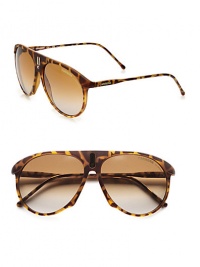 An unique style with a bridge accented with a sleek signature emblem. Available in blonde havana with brown/grey gradient lens. Logo temples100% UV protectionImported