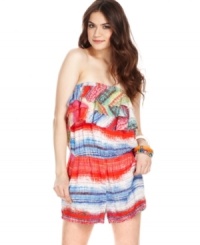 Score beach betty style in this vibrant romper from American Rag! Tiers of ruffles and a colorful print create tropical cool, while a slouchy-chic fit calls for total relaxation! Score beach betty style in this vibrant romper from American Rag! Tiers of ruffles and a colorful print create tropical cool, while a slouchy-chic fit calls for total relaxation!