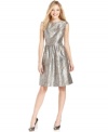 Make the season shine in Jones New York's pretty A-line dress. Sparkling metallic fabric and a classic silhouette create the right look for a special night out.