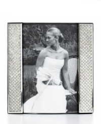 Display a wedding photo with the glitz and glam it deserves in this silver-plated picture frame from Leeber. Clear crystals add extravagant shine to happy memories. Display a wedding photo with the glitz and glam it deserves in this silver-plated picture frame from Leeber. Clear crystals add extravagant shine to happy memories.
