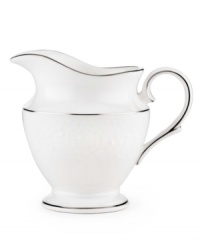 Beautiful and bridal-inspired, this white creamer is richly textured with a delicate floral motif and raised, beaded accents. Finished with a band of polished platinum. Beautiful and bridal-inspired, this white creamer is richly textured with a delicate floral motif and raised, beaded accents. Finished with a band of polished platinum.