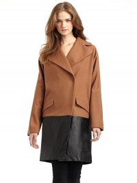 THE LOOKNotch lapelConcealed front snap closureLong sleevesFront flap pocketsExtended leather hemTHE FITAbout 36 from shoulder to hemTHE MATERIAL80% wool/20% nylonTrim: LeatherFully linedCARE & ORIGINDry clean by leather specialistImported THE LOOKNotch lapelConcealed front snap closureLong sleevesFront flap pocketsExtended leather hemTHE FITAbout 36 from shoulder to hemTHE MATERIAL80% wool/20% nylonTrim: LeatherFully linedCARE & ORIGINDry clean by leather specialistImported