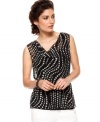 Go day to night in the blink of an eye with this petite top by Jones New York. A sheer cowlneck silhouette is played up with a wavy dot print. (Clearance)