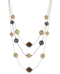 This lengthy layered necklace from Kenneth Cole New York showcases hematite and gold tone wire-wrapped beads and bronze faceted fireball beads. Crafted in gold tone and hematite tone mixed metal. Approximate length: 17 inches + 3-inch extender. Approximate drop: 3 inches. This lengthy layered necklace from Kenneth Cole New York showcases hematite and gold tone wire-wrapped beads and bronze faceted fireball beads. Crafted in gold tone and hematite tone mixed metal. Approximate length: 17 inches + 3-inch extender. Approximate drop: 3 inches.