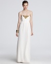 Golden beads at the bodice lend gilded luxury to this Shoshonna strapless gown.