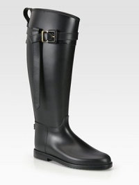 Riding style in waterproof rubber with strap and buckle detail.Shaft, 16½ Leg circumference, 15 Round toe Pull-on style Rubber sole Made in ItalyOUR FIT MODEL RECOMMENDS ordering true whole size; ½ sizes should order the next whole size up. Riding style in waterproof rubber with strap and buckle detail.Shaft, 16½ Leg circumference, 15 Round toe Pull-on style Rubber sole Made in ItalyOUR FIT MODEL RECOMMENDS ordering true whole size; ½ sizes should order the next whole size up.
