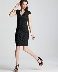 A sophisticated variation on the LBD, this Karen Kane dress boasts a dramatic ruffle cascade for a classic style infused with modern edge. A sophisticated variation on the LBD, this Karen Kane dress boasts a dramatic ruffle cascade for a classic style infused with modern edge.