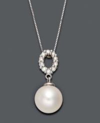 A traditional pearl pendant with an intricate touch. Belle de Mer necklace highlights a cultured freshwater pearl drop (9-10 mm) suspended from an oval-shaped, cut-out bail decorated in sparkling diamonds (1/5 ct. t.w.). Setting and chain crafted in 14k white gold. Approximate length: 18 inches. Approximate drop: 3/4 inch. A traditional pearl pendant with an intricate touch. Belle de Mer necklace highlights a cultured freshwater pearl drop (9-10 mm) suspended from an oval-shaped, cut-out bail decorated in sparkling diamonds (1/5 ct. t.w.). Setting and chain crafted in 14k white gold. Approximate length: 18 inches. Approximate drop: 3/4 inch.