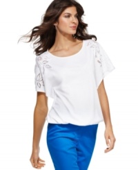 Add a feminine touch to casual days with this Jones New York Signature top. Lace cut-outs at the sleeves and an ultra-chic blouson silhouette make it a great match with vibrant, skinny pants!