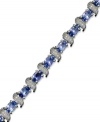 Enhance your look with an element of shine. This stunning sterling silver bracelet showcases oval-cut tanzanite (5-3/4 ct. t.w.) and shimmering diamond accents. Approximate length: 7-1/2 inches.