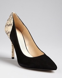 These Enzo Angiolini pointed toe pumps are all-work from the front, with playful backs in snakeskin-embossed leather. These Enzo Angiolini pointed toe pumps are all-work from the front, with playful backs in snakeskin-embossed leather.