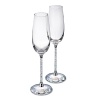 Delicate, elegant and very festive, this is a set of two flutes for very special occasions. The clear crystal that fills the stems and the faceted clear crystal base of each of these adds an element of romance to any evening - making it a touch more special.