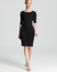 The cornerstone to any 9-to-5 uniform, this black Karen Kane dress flaunts a pleated skirt for a flattering, feminine silhouette. Team with strappy sandals and sleek accents for style that works overtime. The cornerstone to any 9-to-5 uniform, this black Karen Kane dress flaunts a pleated skirt for a flattering, feminine silhouette. Team with strappy sandals and sleek accents for style that works overtime.