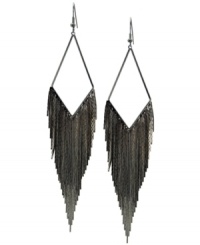 A trendy twist. Drop earrings always have an eye-catching effect, but GUESS' tassel version conveys a chic, bohemian vibe. Crafted in hematite tone mixed metal. Approximate drop: 3 inches.