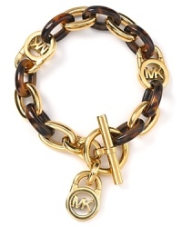 Get linked up: This gold plated metal and tortoise shell bracelet from MICHAEL Michael Kors boldly nods to classic style, accented by modern hardware. Get linked up: This gold plated metal and tortoise shell bracelet from MICHAEL Michael Kors boldly nods to classic style, accented by modern hardware.