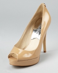 In slick patent leather, these MICHAEL Michael Kors pumps lend timeless style to the office and after hours. In slick patent leather, these MICHAEL Michael Kors pumps lend timeless style to the office and after hours.