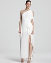 BCBGMAXAZRIA masters modern glamour with this floor-sweeping gown, boasting a one-shoulder silhouette and cascading skirt.