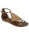 Metallic shine is all you need. Fergie's Tennessee wedge thong sandals will dress up all your casual looks.