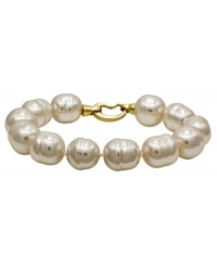 From the island of Mallorca, Spain, this bracelet features white baroque organic man-made pearls (14 mm) with an 18k gold over sterling silver clasp. Approximate length: 7-1/2 inches.