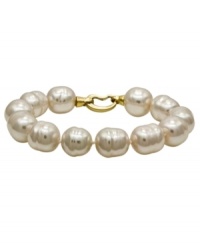 From the island of Mallorca, Spain, this bracelet features white baroque organic man-made pearls (14 mm) with an 18k gold over sterling silver clasp. Approximate length: 7-1/2 inches. From the island of Mallorca, Spain, this bracelet features white baroque organic man-made pearls (14 mm) with an 18k gold over sterling silver clasp. Approximate length: 7-1/2 inches.