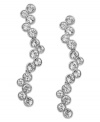 Timeless, feminine and graceful. Swarovski's rhodium-plated pierced earrings present a beautiful, fluid silhouette in sparkling clear crystal pavé. Set in mixed metal. Approximate drop: 1-5/8 inches.