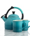 Tea up. A go-to gift idea, this mug & kettle set boasts a brilliant palette of Le Creuset's signature hues, plus, all the convenience and handcrafted excellence of the renowned French name. A stylish kettle and two matching stoneware mugs make tea & coffee time effortlessly simple and charming. 5-year limited warranty on mugs; 10-year limited warranty on kettle.