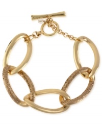 All that glitters is this toggle link bracelet from Kenneth Cole New York. Crafted from gold-tone mixed metal, the bracelet truly sparkles. Item comes packaged in a signature Kenneth Cole New York Gift Box. Approximate diameter: 2-1/2 inches. All that glitters is this toggle link bracelet from Kenneth Cole New York. Crafted from gold-tone mixed metal, the bracelet truly sparkles. Item comes packaged in a signature Kenneth Cole New York Gift Box. Approximate diameter: 2-1/2 inches.