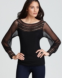 Exquisite, feminine details enrich this sassy sheer top by GUESS. Exquisite, feminine details enrich this sassy sheer top by GUESS.