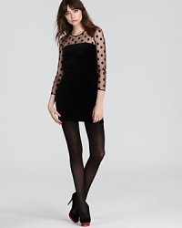 Darling polka dots go dramatic against a sleek Juicy Couture dress flaunting a sultry sheer yoke and slimming body-con silhouette. Darling polka dots go dramatic against a sleek Juicy Couture dress flaunting a sultry sheer yoke and slimming body-con silhouette.