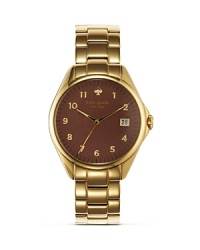 kate spade new york's signature style is on time with this gleaming bracelet watch. Crafted of gold plate with a richly hued dial, it's a practical way to tap into the brand's playful aesthetic. kate spade new york's signature style is on time with this gleaming bracelet watch. Crafted of gold plate with a richly hued dial, it's a practical way to tap into the brand's playful aesthetic.