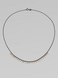 A delicate design with 14k gold beads on oxidized sterling silver chain. 14k gold beadsOxidized sterling silverLength, about 16Spring ring closureMade in USA 