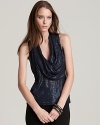 An effortless draped neck contrasts gilded sequins on this Anne Klein New York top for a standout evening look.