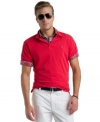 Bright spot. With a cool saturated color, this Izod polo shirt will be an instant favorite.