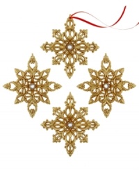 Let it show. Gold snowflake ornaments gleam from any branch thanks to a brilliant glitter finish and sparkling white center. With two distinct designs. Let it show. Gold snowflake ornaments gleam from any branch thanks to a brilliant glitter finish and sparkling white center. With two distinct designs.