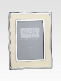 From the Como Collection. Inspired by the gentle ripples and soft hues of Italy's Lake Como, this enamel frame has wavy edges that add rich character to a favorite photo.Enamel over aluminumRed leather backHolds a 5 X 7 photoMade in USA From the Como Collection. Inspired by the gentle ripples and soft hues of Italy's Lake Como, this enamel frame has wavy edges that add rich character to a favorite photo.Enamel over aluminumRed leather backHolds a 5 X 7 photoMade in USA