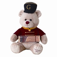 A sweet tradition, Godiva's annual Holiday Gund® is dressed in a Nutcracker-inspired red coat and embroidered hat. Comes with a solid milk chocolate bar.