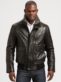 This classic bomber style is perfect for any occasion, shaped in supple leather with a removable genuine dyed shearling collar for the ultimate experience of warmth and comfort.Zip frontButtoned placketWaist flap pocketsRibbed knit hemFully linedAbout 27 from shoulder to hem LeatherDry cleanImportedFur origin: Portugal This classic bomber style is perfect for any occasion, shaped in supple leather with a removable genuine dyed shearling collar for the ultimate experience of warmth and comfort.Zip frontButtoned placketWaist flap pocketsRibbed knit hemFully linedAbout 27 from shoulder to hem LeatherDry cleanImportedFur origin: Portugal