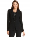 Sharp tuxedo styling elevates Calvin Klein's single-button blazer, while satin lapels amp up the glamorous look.