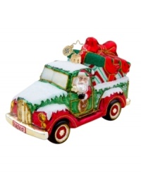 Santa treks in from the North Pole in his pickup, the only way to get oversize gifts under the tree! Handcrafted in pure glass with elaborate hand-painted detail, like a Radko license plate, sparkly gold rims and candy-stripe gift wrap. Santa treks in from the North Pole in his pickup, the only way to get oversize gifts under the tree! Handcrafted in pure glass with elaborate hand-painted detail, like a Radko license plate, sparkly gold rims and candy-stripe gift wrap.