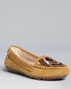 House of Harlow 1960 takes its vintage styling into updated, of-the-moment moccasin loafer flats.