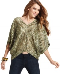 Couture inspiration is in full supply on this oversized, knit pullover from Jessica Simpson! Couture inspiration is in full supply on this oversized, knit pullover from Jessica Simpson!