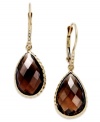 Take your look to the next level with the right amount of color. Pear-cut smokey topaz (10 ct. t.w.) adds the sparkle to these shining 14k gold earrings with diamond accents. Approximate drop: 1-1/4 inches.
