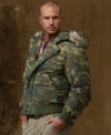 It's a jungle out there, but you won't blend in by wearing this bold, feather-filled camouflage jacket that features a fleece-lined hood with trim and cozy hand pockets for braving the elements.