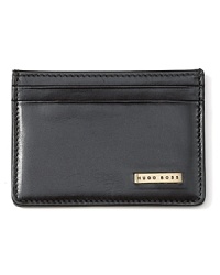 Wrought in quality burnished leather, this slim credit card case features a logo plaque on the front, clear ID holder and 2 exterior credit card slots.