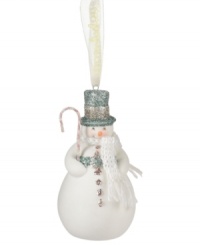 Crafted of pure porcelain bisque, bring some winter cheer to your tree this season with the snowman ornament from Department 56. Features a blue and silver top hat, white knit scarf and festive candy cane accessory. Crafted of pure porcelain bisque, bring some winter cheer to your tree this season with the snowman ornament from Department 56. Features a blue and silver top hat, white knit scarf and festive candy cane accessory.