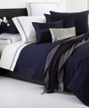 This Windsor Navy sham from Hugo Boss is the perfect finishing touch for your bedding ensemble. 350-thread count cotton sateen fabric provides endless comfort. Zipper closure.