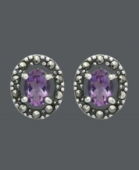 Button up your look in rich and regal hues. Genevieve & Grace stud earrings feature beautiful, oval-cut amethyst gemstones (1-1/3 ct. t.w.) encircled by glittering marcasite. Crafted in sterling silver. Approximate diameter: 1/2 inch.