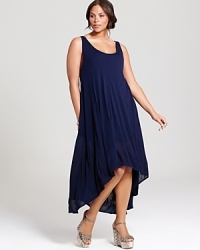 A fresh update on the classic black dress, this chic navy Nation LTD Plus dress breathes new life into your summer repertoire with a flowing, sheer silhouette. A fresh update on the classic black dress, this chic navy Nation LTD Plus dress breathes new life into your summer repertoire with a flowing, sheer silhouette.